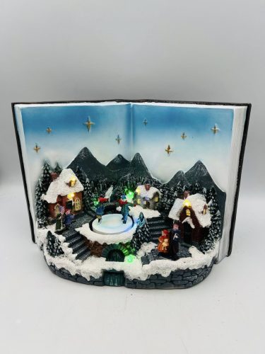 Zenélő Nyitott Könyv – Téli Falu Jelenettel, Forgó Gyerekekkel és LED Világítással (29×20 cm)